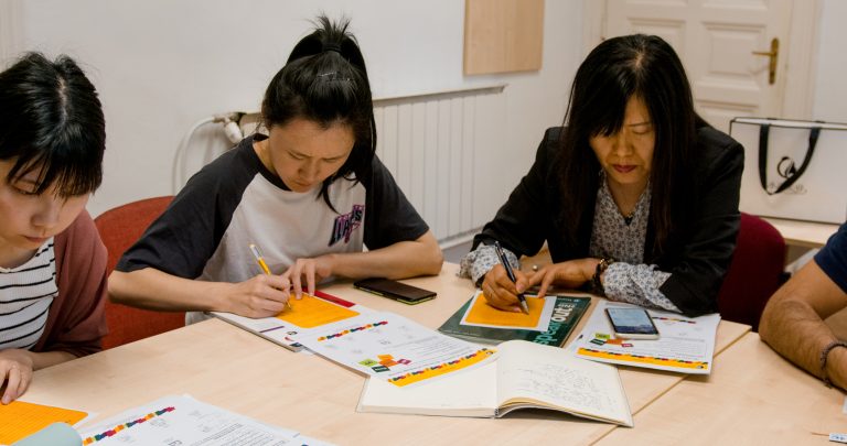 Students writing in classroom